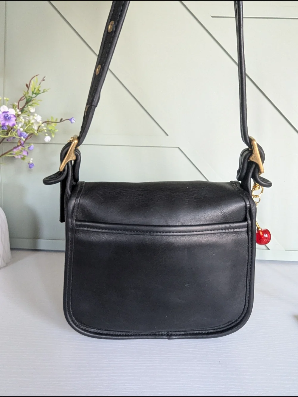 Coach Black Leather Crossbody with Gold Hardware and Cherry Charm